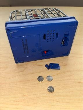ABC Trading toy recall image showing accessible battery compartment on dinosaur toy cage
