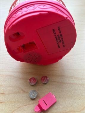ABC Trading toy recall image showing accessible battery compartment on pink bird cage toy