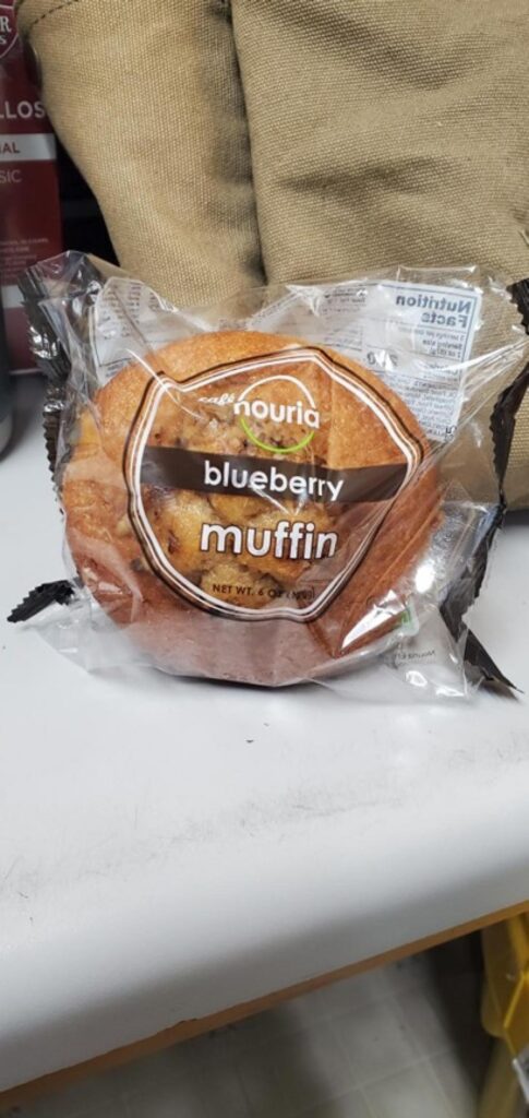 Nouria blueberry muffin packaged in clear plastic wrapper recalled due to undeclared walnuts and tree nut allergy risk.