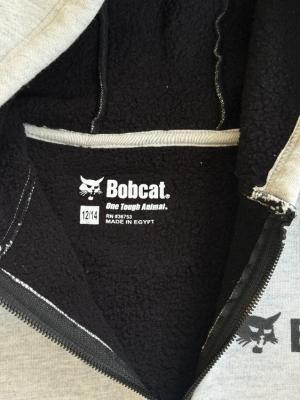 Close-up label inside recalled Bobcat youth sweatshirt included in CPSC recall